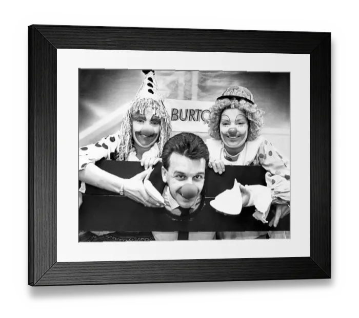 Framed Print : Duncan Waddle gets in in the face from shop assistants Gilliam jWatkins, left