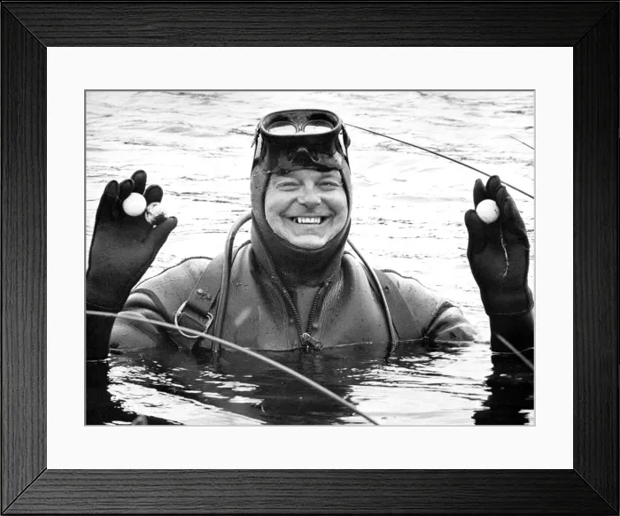 Framed Print : Brian Powton wears flippers adn an aqualung for the 10th hole of his local golf course Framed Print : Brian Powton wears flippers adn an aqualung for the 10th hole of his local golf course