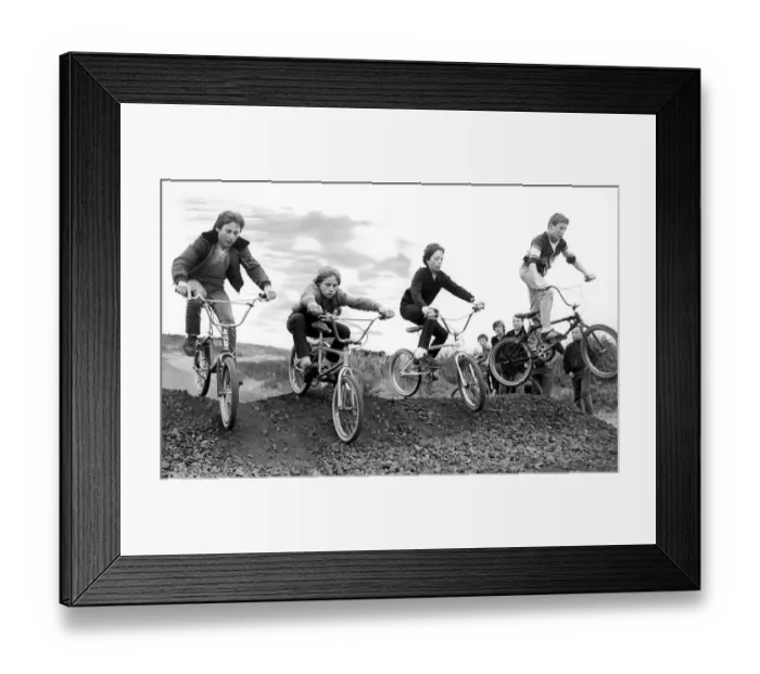 Framed Print : A group of children try out an obstacle on the new BMX track