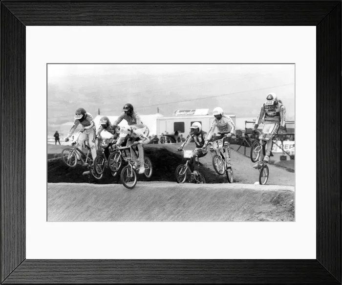 Framed Print : Adults BMX racing over a specially prepared course Framed Print : Adults BMX racing over a specially prepared course