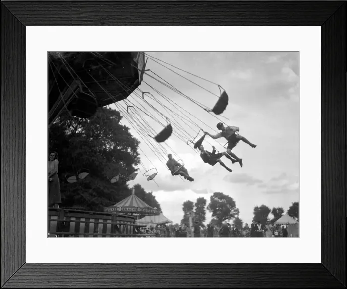 Framed Print : Children ride the Chair-a-Plane ride at the Surbiton fair. Circa 1930