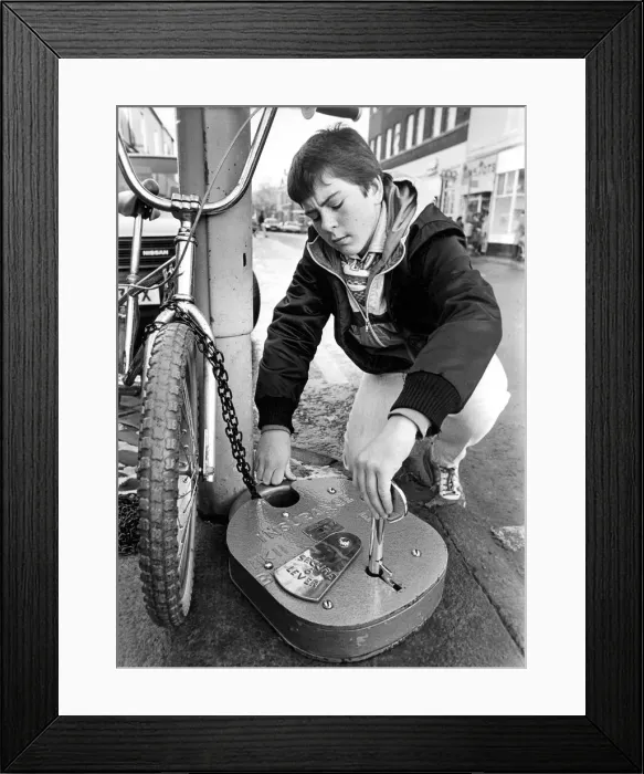 Framed Print : You cannot be too careful these days so Tyneside BMX biker Paul Snowden locks up his bike Framed Print : You cannot be too careful these days so Tyneside BMX biker Paul Snowden locks up his bike