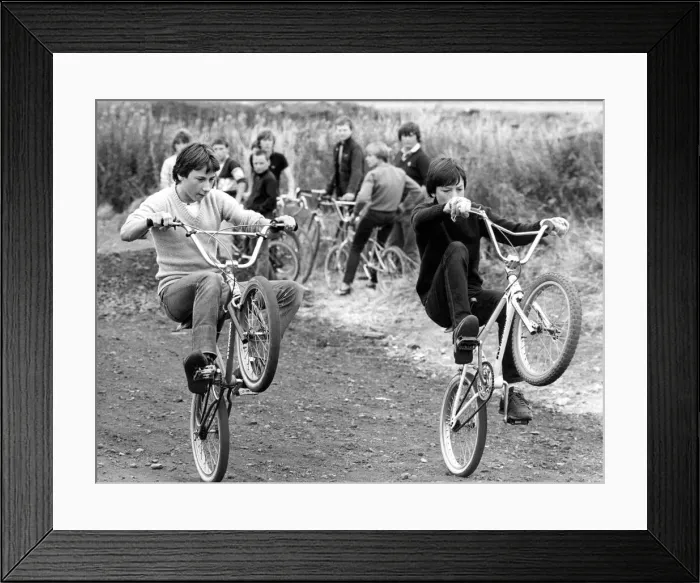 Framed Print : Children doing stunts on their BMX bikes Framed Print : Children doing stunts on their BMX bikes
