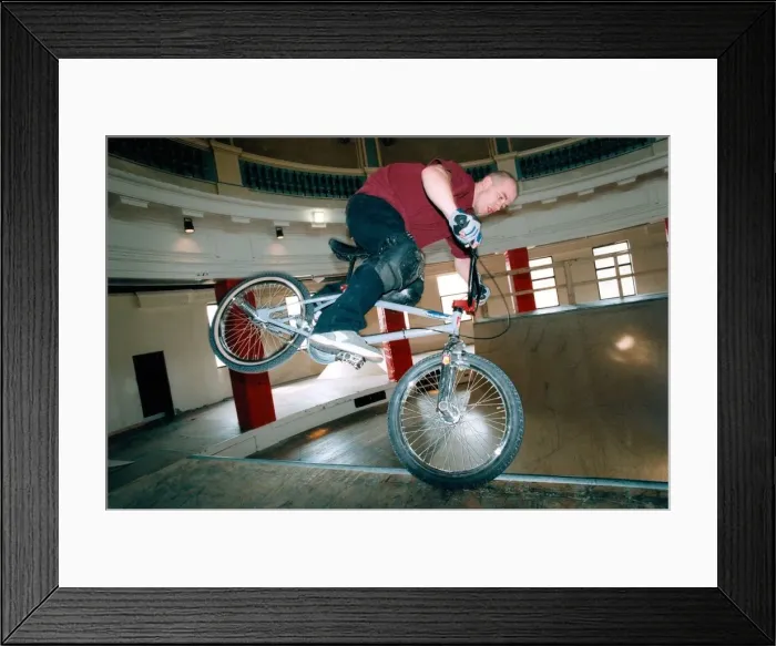 Framed Print : Dave Young shows his skills on the new bike and skateboard ramps inside the Spanish City
