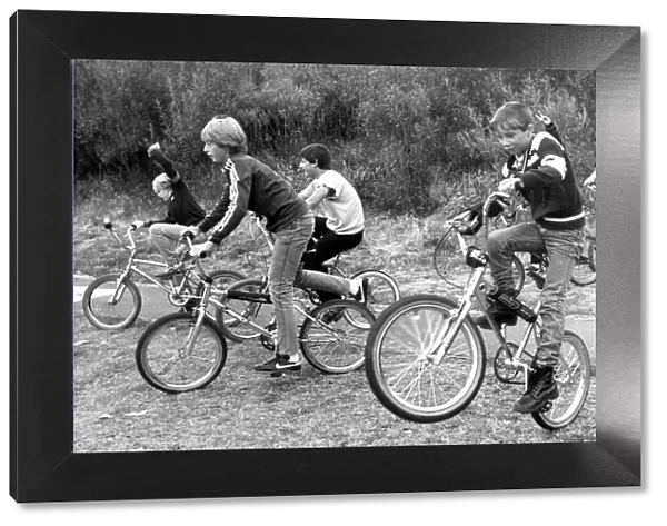 Children riding their mountain bikes in Ayton Park, Byker