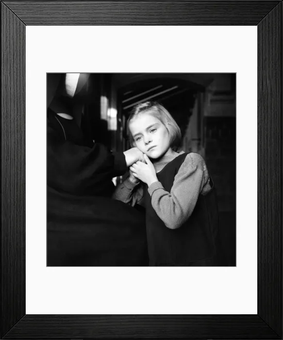 Framed Print : Children. Orphan girl looking out of window. December 1953 D7311-004 Framed Print : Children. Orphan girl looking out of window. December 1953 D7311-004