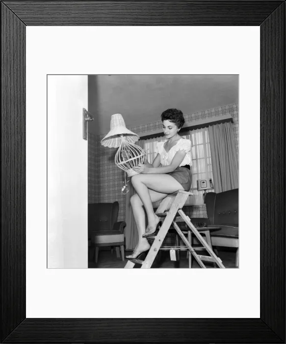 Framed Print : Miss Madeleine Mono was film starlet, now to be married, decorates flat Framed Print : Miss Madeleine Mono was film starlet, now to be married, decorates flat