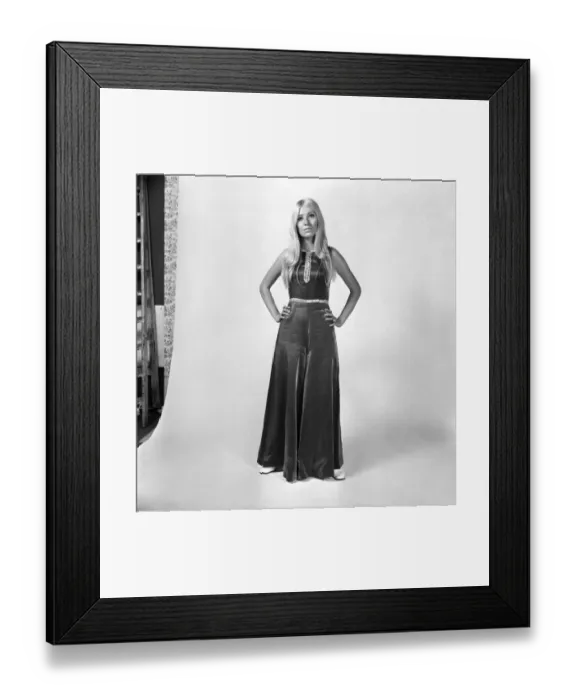 Framed Print : Eva Haraldsted, ex-girl friend of soccer star George Best wears a shimmering black