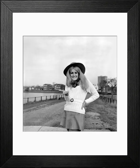 Framed Print : Young woman wearing a hat, mini skirt and knee high boots on the sea front at Southampton Framed Print : Young woman wearing a hat, mini skirt and knee high boots on the sea front at Southampton