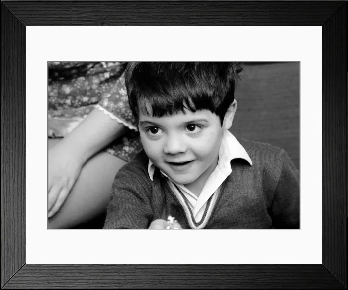 Framed Print : Little abandoned boy who calls himself George Mason settles down in a children Framed Print : Little abandoned boy who calls himself George Mason settles down in a children
