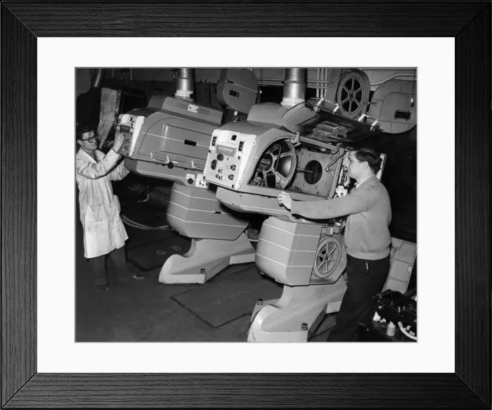 Framed Print : Its a far cry from the silent eras film projectors to these massive machines Framed Print : Its a far cry from the silent eras film projectors to these massive machines