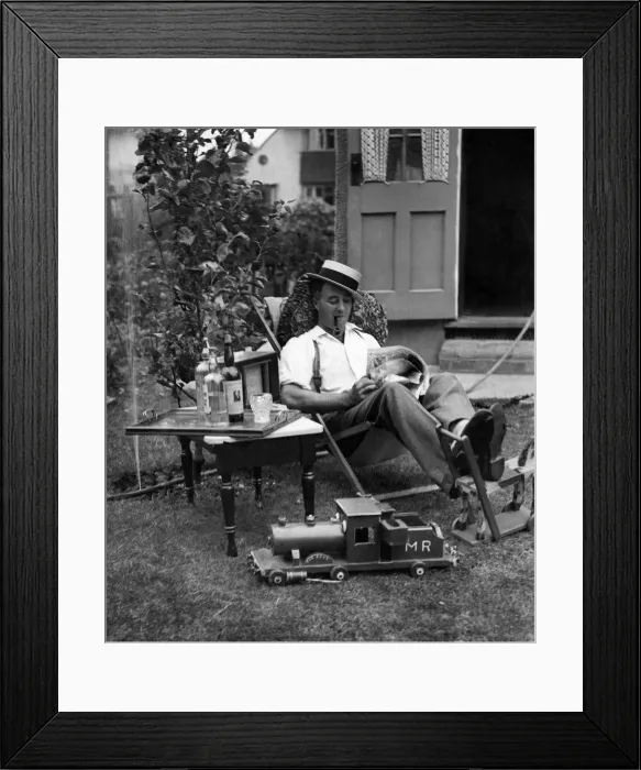 Framed Print : Ernest Barnes of Motspur Park, New Malden, relaxes at home in his garden Framed Print : Ernest Barnes of Motspur Park, New Malden, relaxes at home in his garden