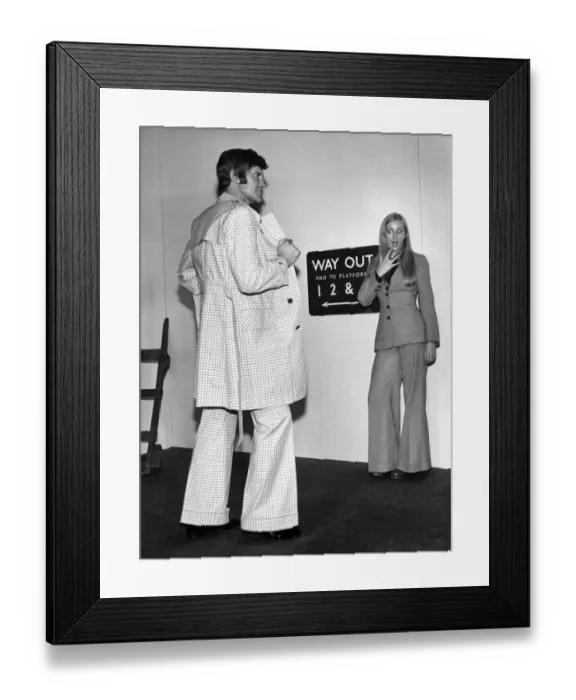 Framed Print : Model girl Jo Dickinson gets a close-up of the trendy way-out fashion for men