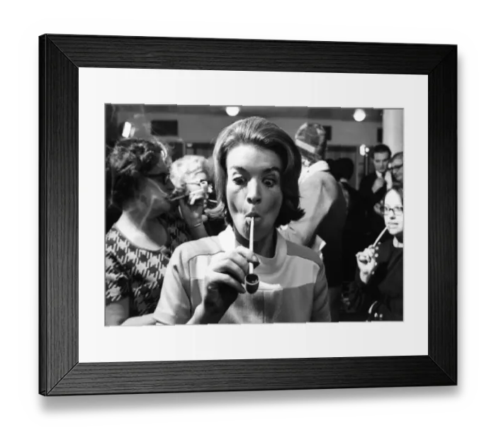 Framed Print : Blonde 28-year-old Jane Lumby experiments with her first pipe smoke at the Festival Hall