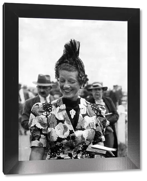 Woman wearing glamourous outfit for the day sracing at Royal Ascot June 1937