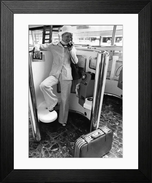 Framed Print : Woman wearing a suit talking on the telephone. May 1973 P008442 Framed Print : Woman wearing a suit talking on the telephone. May 1973 P008442