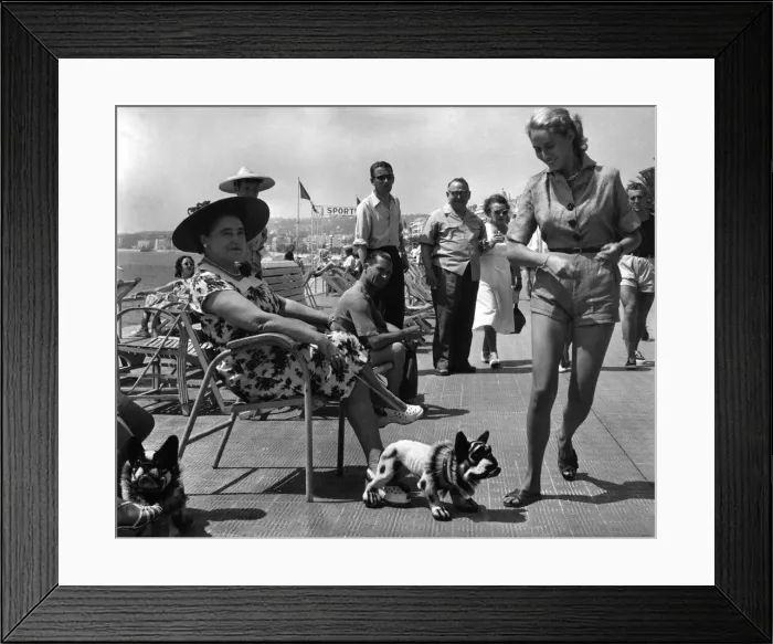 Framed Print : Strollers on the Promenade Des Anglais get a shock of their lives while walking past an