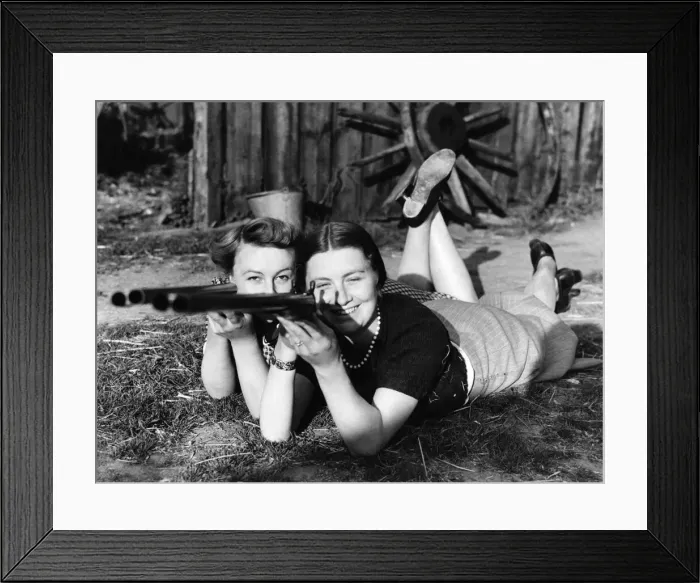 Framed Print : Annie get your gun: A couple of young Kent farmers wives learn how to aim Framed Print : Annie get your gun: A couple of young Kent farmers wives learn how to aim