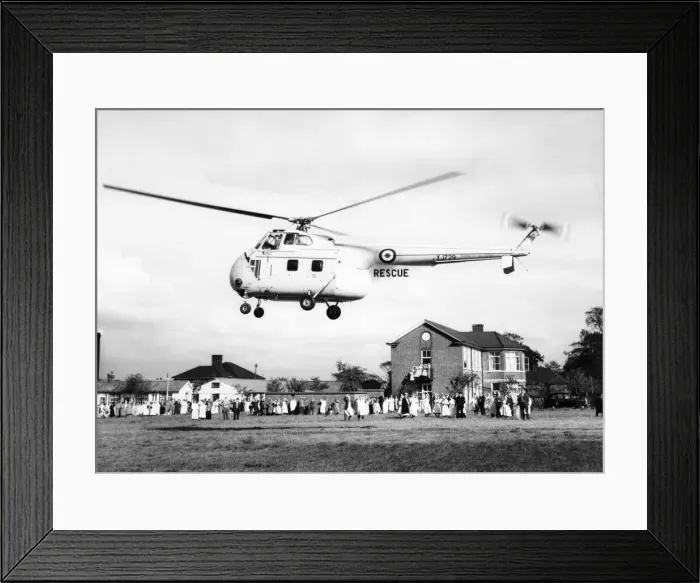 Framed Print : With a doctor and nurse at his side, a boy is being taken by this R. A. F Framed Print : With a doctor and nurse at his side, a boy is being taken by this R. A. F
