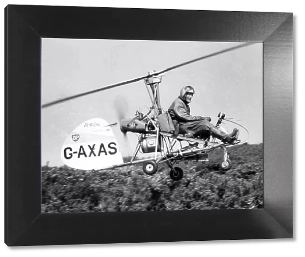 A tiny Autogyro, flown by its designer Wing Cmdr. Ken Wallis searched the areas of