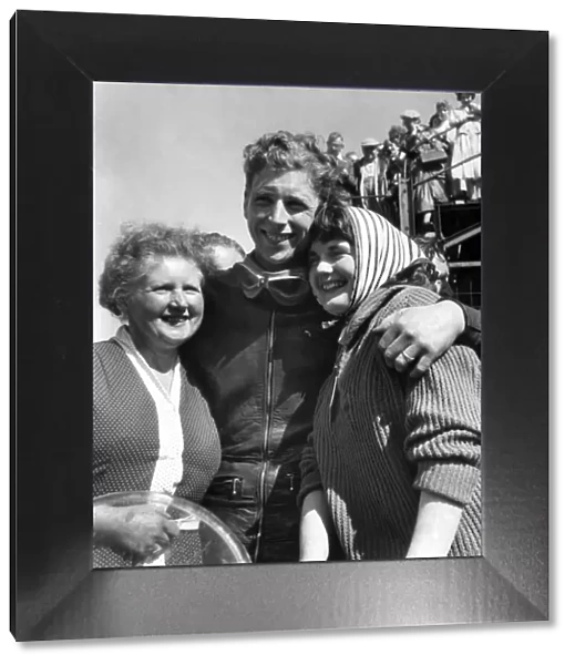 TT Races 1958: Winners Hug. Alan Shepherd hugs his wife, Ann, and his mother, Mrs