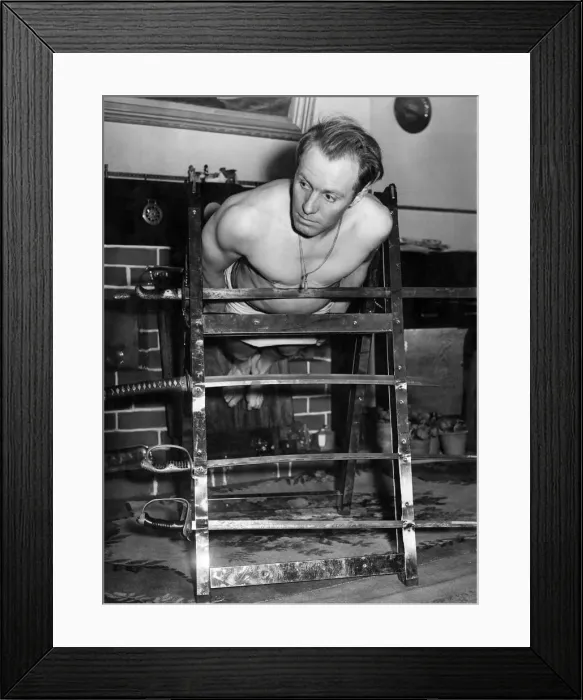 Framed Print : Yogi Special: Albert Buxton seen here balancing on swords. November 1953 P005252