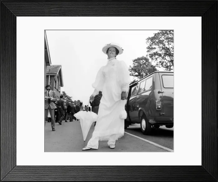 Framed Print : Woman wearing long white dress with matching hat and umbrella on the first day of Royal