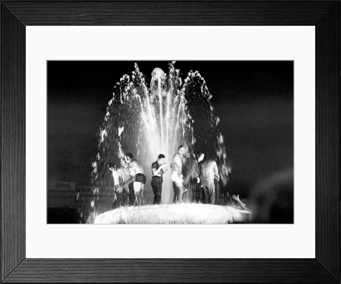 Framed Print : Election night scene in Trafalgar Square. Revellers celebrating in the fountains after Framed Print : Election night scene in Trafalgar Square. Revellers celebrating in the fountains after