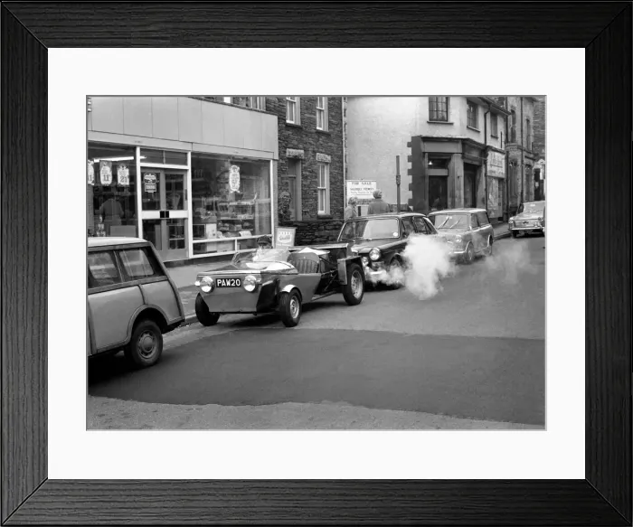 Framed Print : Man driving a steam powered car near his home December 1970 70-11615-009