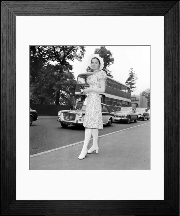 Framed Print : Woman wearing floral patterned knee length dress with hat on the first day of Royal Framed Print : Woman wearing floral patterned knee length dress with hat on the first day of Royal