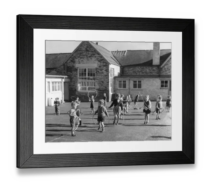 Framed Print : Children enjoy the playtime with skipping and hula hoops at Waterhouses School