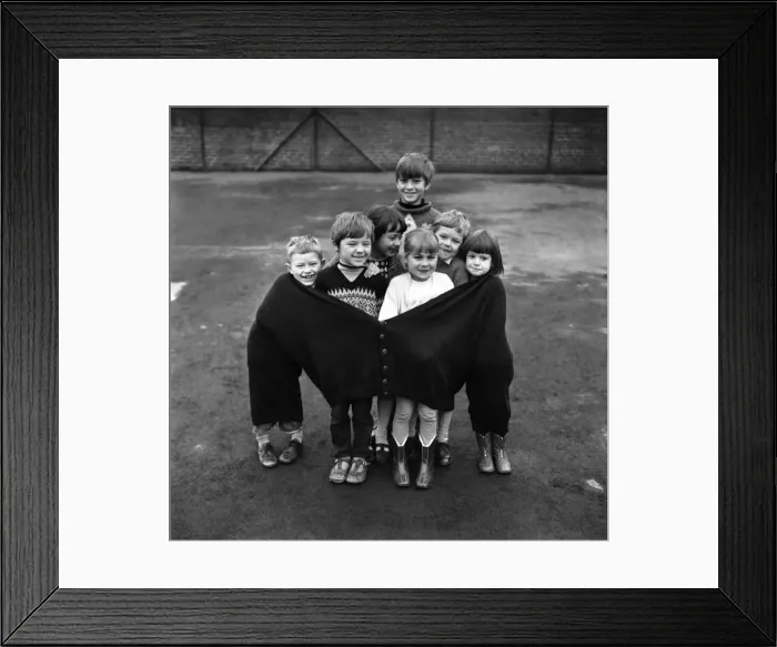 Framed Print : The seven children in the fat mans pullover are (left to right Framed Print : The seven children in the fat mans pullover are (left to right