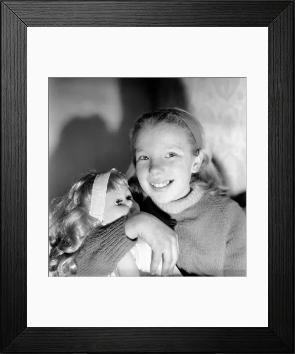 Framed Print : Girl playing with toy doll. December 1969 Z12000-002 Framed Print : Girl playing with toy doll. December 1969 Z12000-002