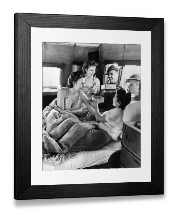 Framed Print : World War II Women. Three ATS girls who live in a Caravan seen here getting the attention Framed Print : World War II Women. Three ATS girls who live in a Caravan seen here getting the attention