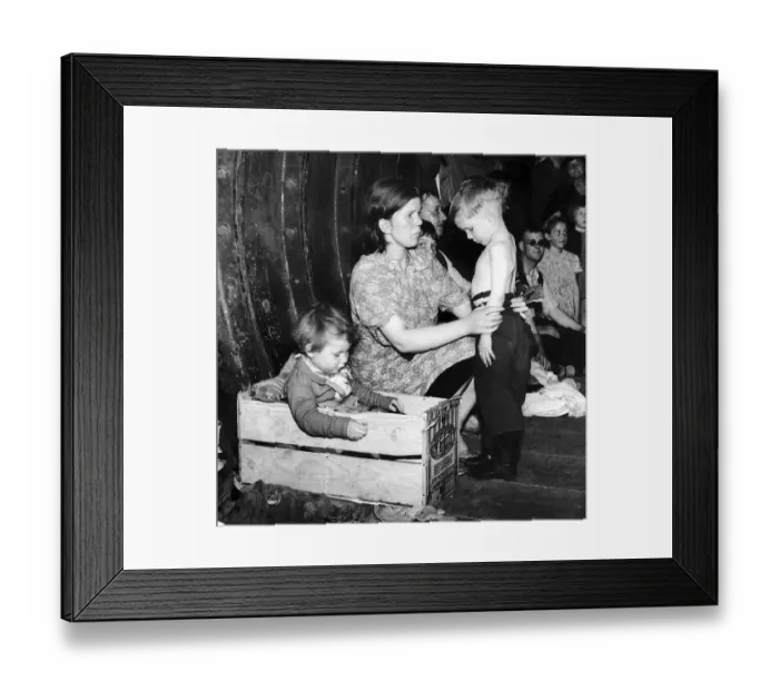 Framed Print : A mother tends to her young son in an underground bomb shelter during an air raid while Framed Print : A mother tends to her young son in an underground bomb shelter during an air raid while