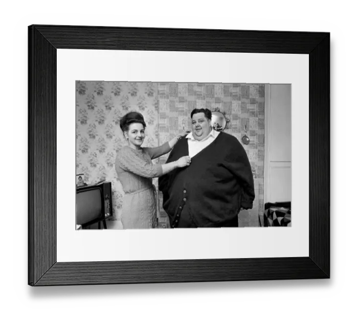 Framed Print : Worlds Fattest Man: Mrs. Gwen Matthewman fitting 38-stone Arthur Armitage with Framed Print : Worlds Fattest Man: Mrs. Gwen Matthewman fitting 38-stone Arthur Armitage with