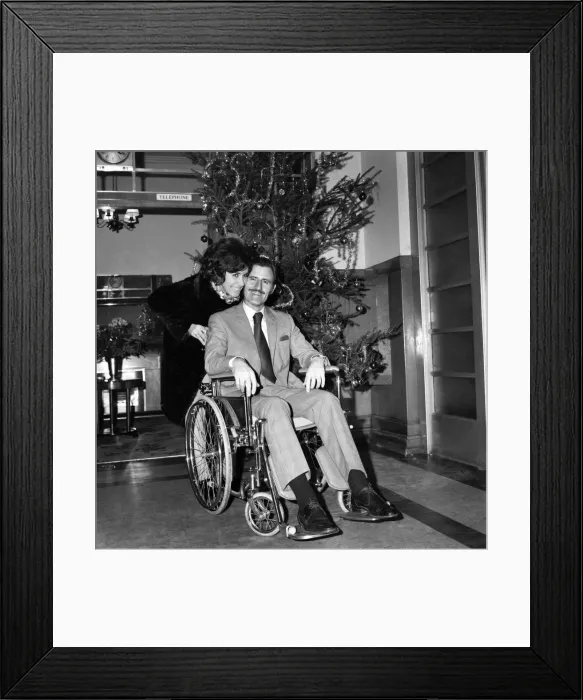 Framed Print : Racing driver Graham Hill left University College Hospital, in a wheelchair Framed Print : Racing driver Graham Hill left University College Hospital, in a wheelchair