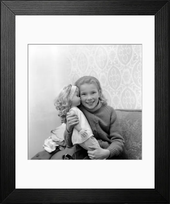 Framed Print : Girl playing with toy doll. December 1969 Z12000-001 Framed Print : Girl playing with toy doll. December 1969 Z12000-001