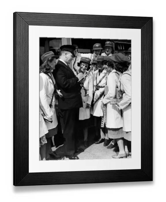Framed Print : World War II Women: London transport - conductresses seen here reporting to the inspector