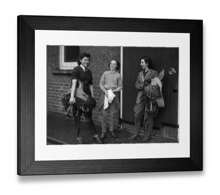 Framed Print : World War II Women. Three women in the land army prepare to go riding after a hard days Framed Print : World War II Women. Three women in the land army prepare to go riding after a hard days