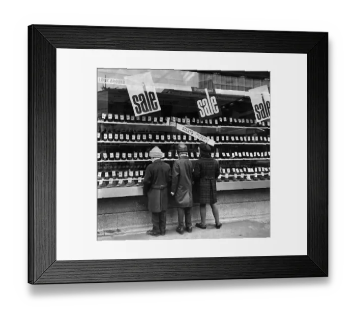 Framed Print : Sales Window Shopping by a shoe shop. P005427