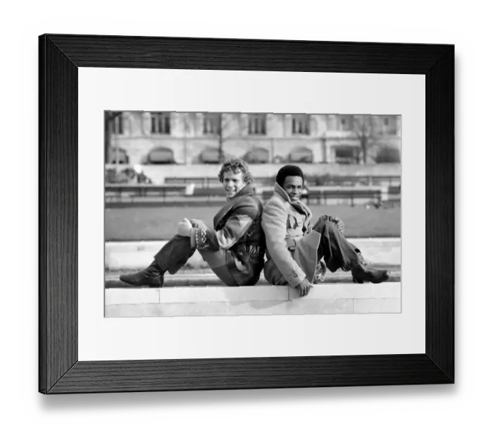 Framed Print : Boxer Hedgman Lewis with actor Ryan O Neill. January 1975 75-00255