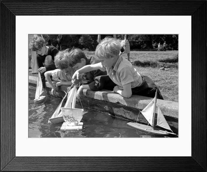 Framed Print : Four Boys enjoy a bit of model boat sailing during an open day at Bilton Grange boarding Framed Print : Four Boys enjoy a bit of model boat sailing during an open day at Bilton Grange boarding