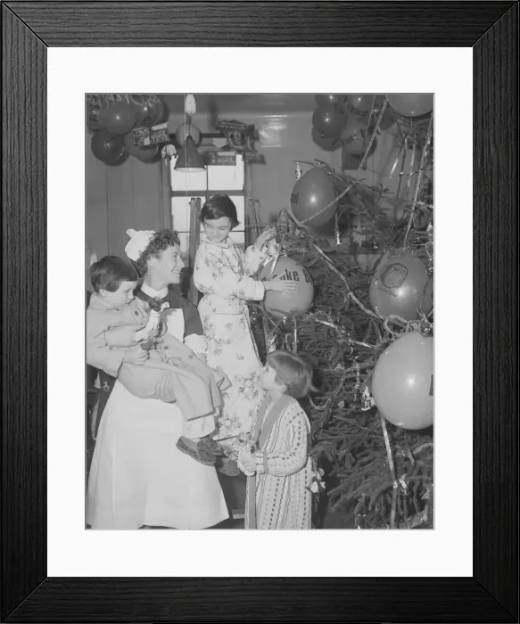 Framed Print : Decorating the Christmas tree is a perogative of the ward sister Framed Print : Decorating the Christmas tree is a perogative of the ward sister
