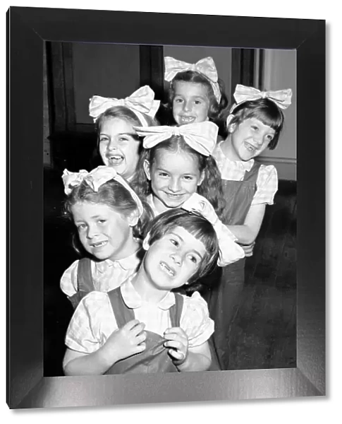 Six little dancing girls smile to camera and reveal that they have all lost their front