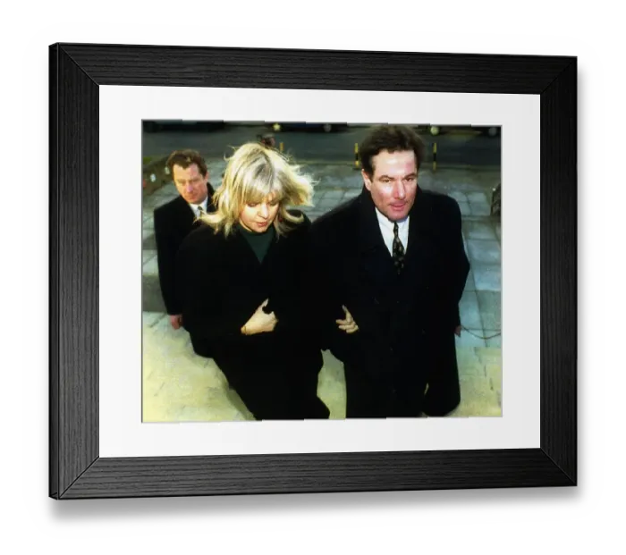 Framed Print : Former Liverpool Councillor Derek Hatton with his wife Shirley at Mold Crown Court for a