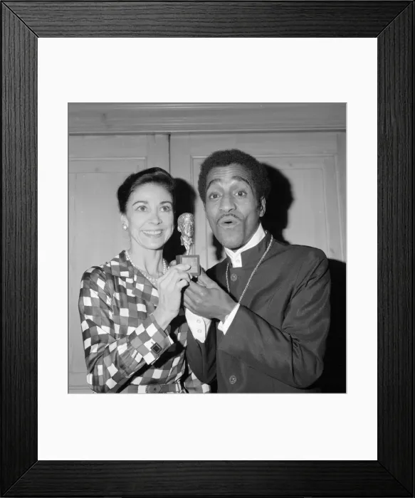 Framed Print : Sammy Davis Jnr with Dame Margot Fontayn who handed him a statue of the man himself as a Framed Print : Sammy Davis Jnr with Dame Margot Fontayn who handed him a statue of the man himself as a