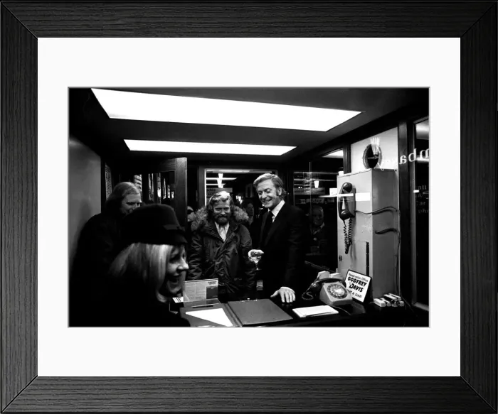 Framed Print : Film legend Michael Caine off-camera with a glass of wine in Godrey Davies car hire Framed Print : Film legend Michael Caine off-camera with a glass of wine in Godrey Davies car hire