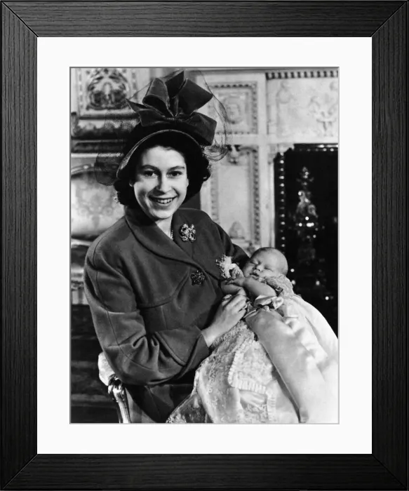 Framed Print : Princess Elizabeth holds her baby son Prince Charles in the drawing room at Buckingham Framed Print : Princess Elizabeth holds her baby son Prince Charles in the drawing room at Buckingham
