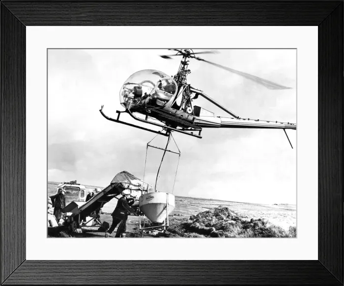 Framed Print : Forestry men near Wark, Northumberland, at work loading chemicals into a hopper slung Framed Print : Forestry men near Wark, Northumberland, at work loading chemicals into a hopper slung